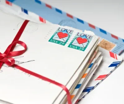 love letters tied with a red ribbon